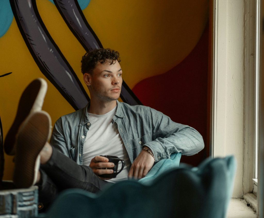 Man sitting quietly by a window