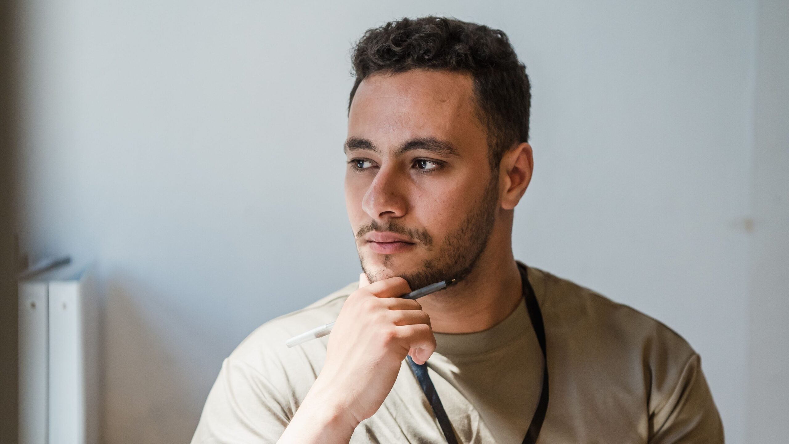 Professional sitting thoughtfully in an office during the working day